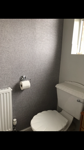 Showing wallpaper Arthouse Linen Texture Mid Grey Wallpaper - 676007 on the wall