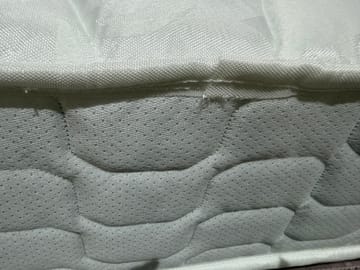A customer photo for Silentnight Double Sided Miracoil Mattress - Very hard bed and cotton hanging delivery was really bad as they couldnt hardly . Author: Customer. Dated: 2026-02-06